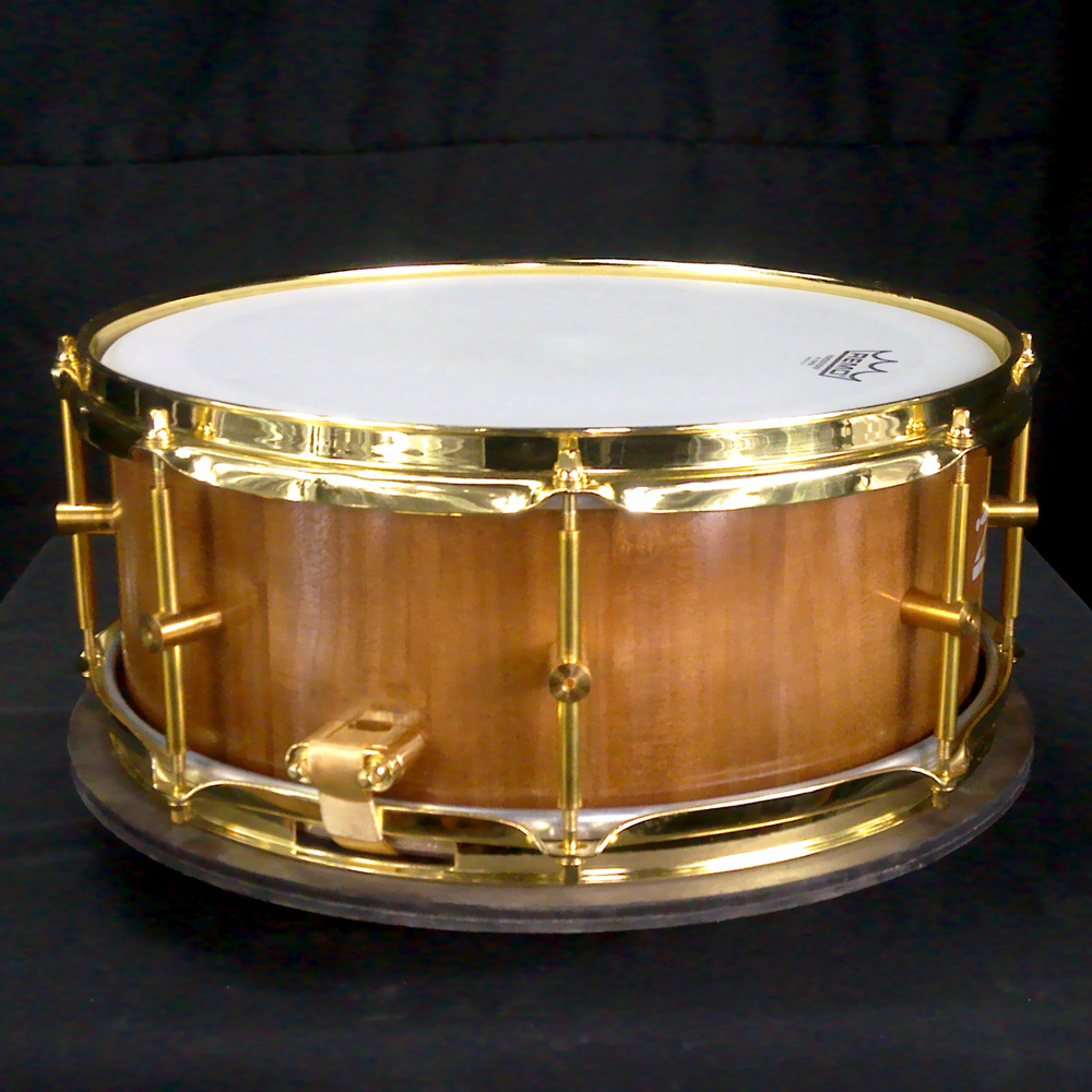 Cherry stave snare drum with brass hardware
