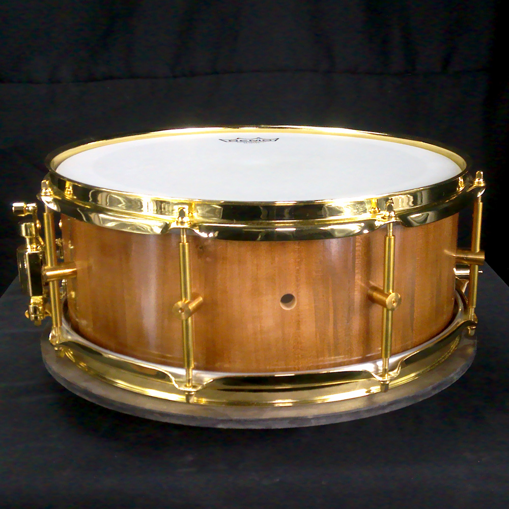 Cherry stave snare drum with brass hardware