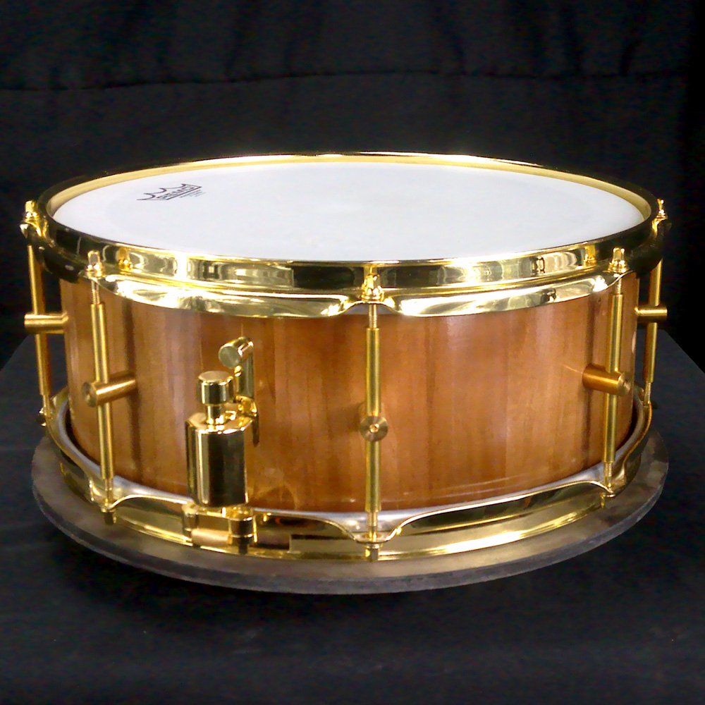 Cherry stave snare drum with brass hardware