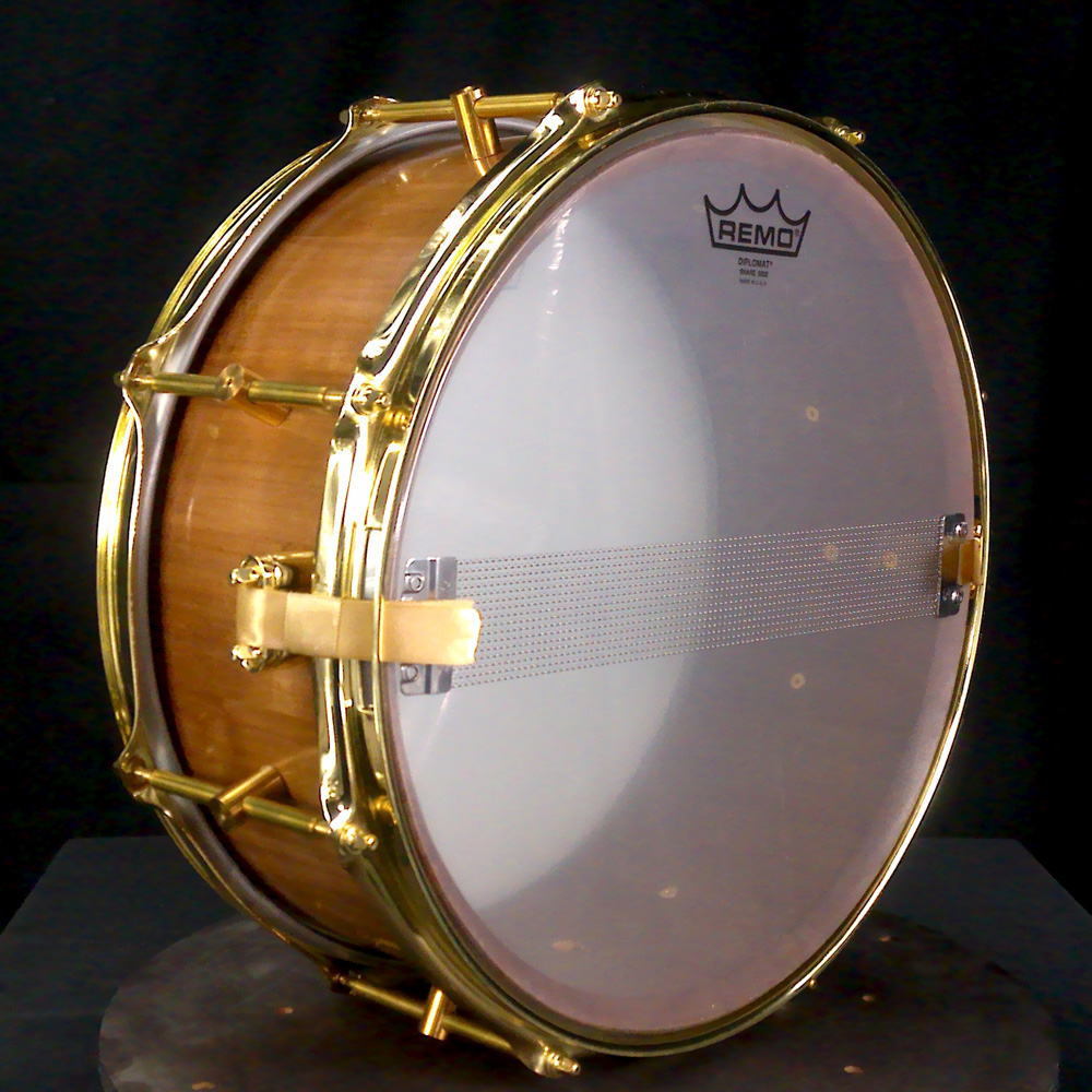 Cherry stave snare drum with brass hardware