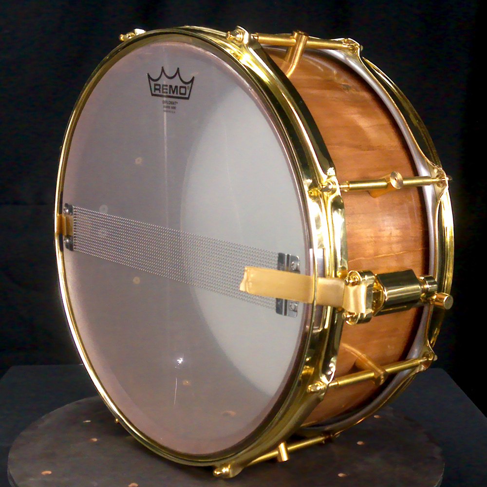 Cherry stave snare drum with brass hardware
